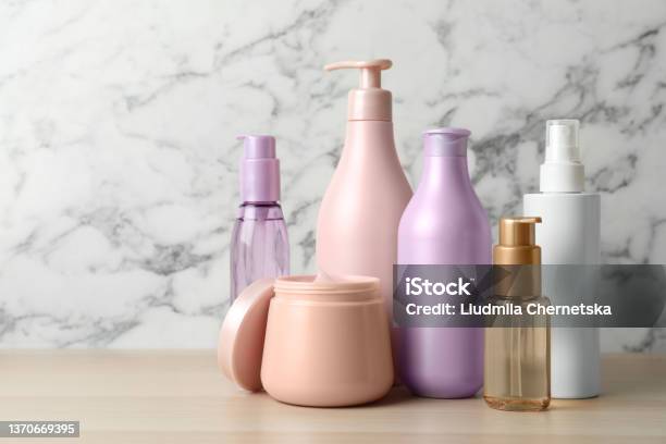 Different Hair Care Products On Wooden Table Stock Photo - Download Image Now - Merchandise, Hair, Beauty Spa