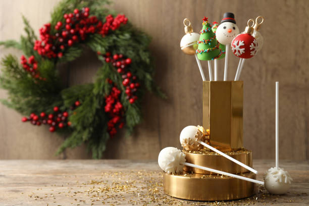 istock Delicious Christmas themed cake pops on wooden table. Space for text 1370669930