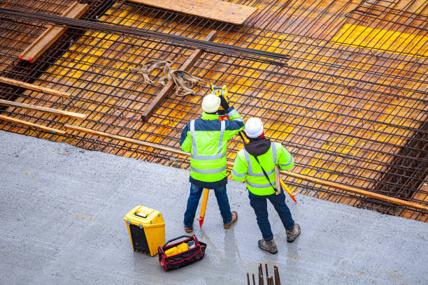 istock Surveyors at the construction site 1370670750