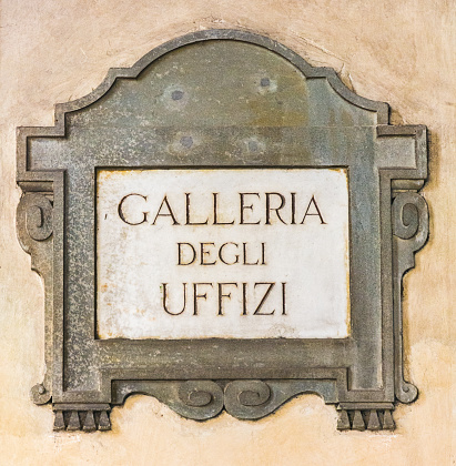 Florence, Italy - MAY 13,2019: Galleria degli Uffizi Street sign on the wall in Florence, Tuscany, Italy