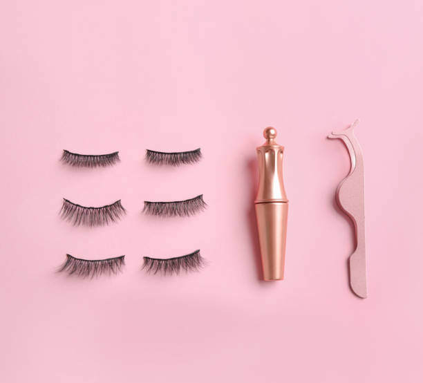 istock Flat lay composition with magnetic eyelashes and accessories on pink background 1370671003