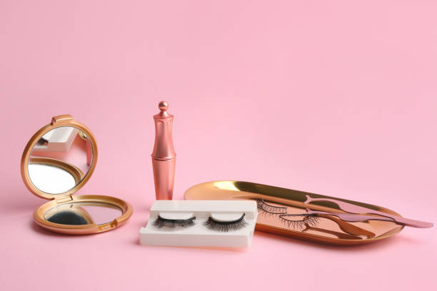 istock Magnetic eyelashes and accessories on pink background 1370671094