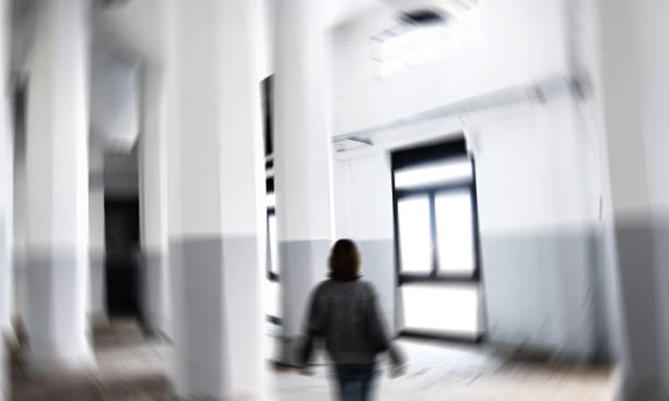 istock Woman silhouette in abandoned building. 1370671101