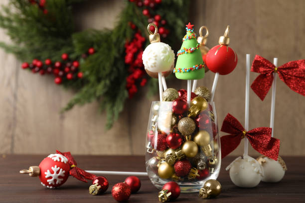 istock Delicious Christmas themed cake pops on wooden table 1370671154