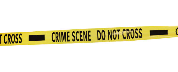 istock Yellow crime scene tape isolated on white 1370672267
