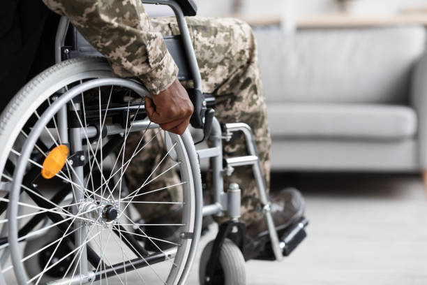istock Unrecognizable black soldier sitting in wheelchair, copy space 1370672729