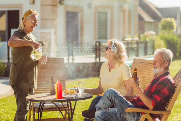 istock Elderly people having an outdoor lunch 1370673937