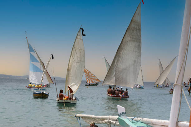 salvador, bahia, brazil - november 16, 2010: sloop boats are seen during Joao das Botas regatta in Todos os Santos Bay.