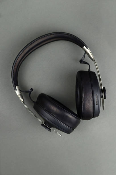 istock Wireless headphones with leather ear pads on a gray background 1370675253