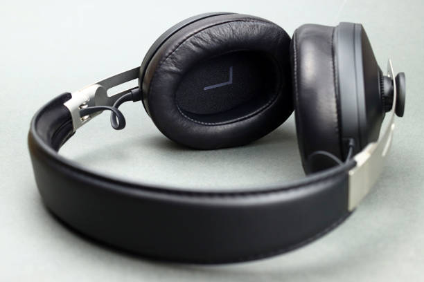 istock Wireless headphones with leather ear pads on a gray background 1370675292