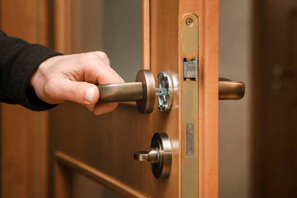 Fixing door lock master. Door handle installing. Fixing door lock master. door chain stock pictures, royalty-free photos & images