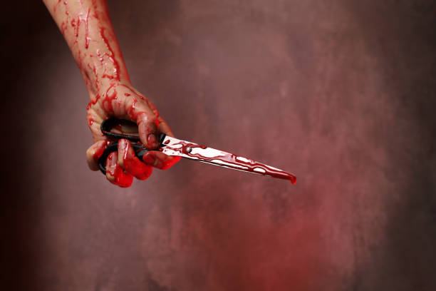 woman's hand holds a bloody pair of scissors woman's hand holds a bloody pair of scissors angry hairstylist stock pictures, royalty-free photos & images