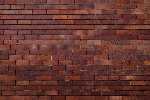 Section of an old brick wall of different colors.