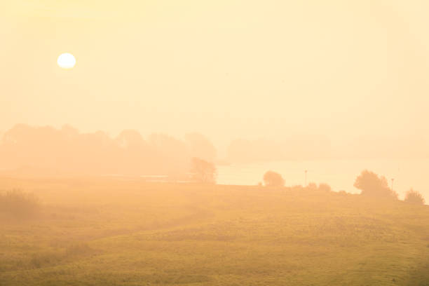 Sunrise over the river IJssel during a beautiful fall morning in the IJsseldelta region in Overijssel, The Netherlands.