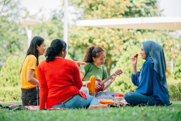 istock Taking food and playing guitar, enjoyment. 1370681861