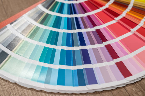 istock Color stack of test samples for paint or fabric in rainbow spectrum colors on the table. 1370682725