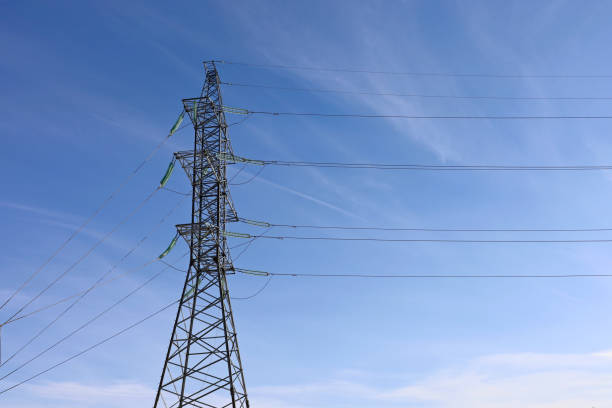 istock High voltage tower with electrical wires on blue sky background 1370684101