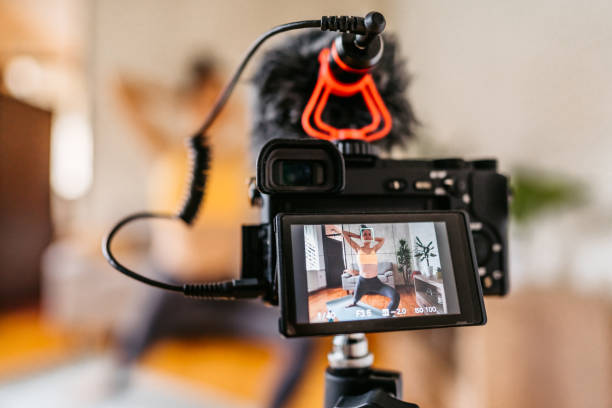 istock Woman Vlogger Practicing Yoga From Home 1370684523