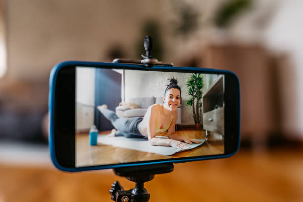 istock Woman Vlogger Practicing Yoga From Home 1370684550