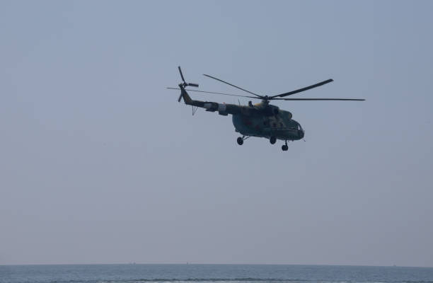 istock The military helicopter against the blue sky 1370685217