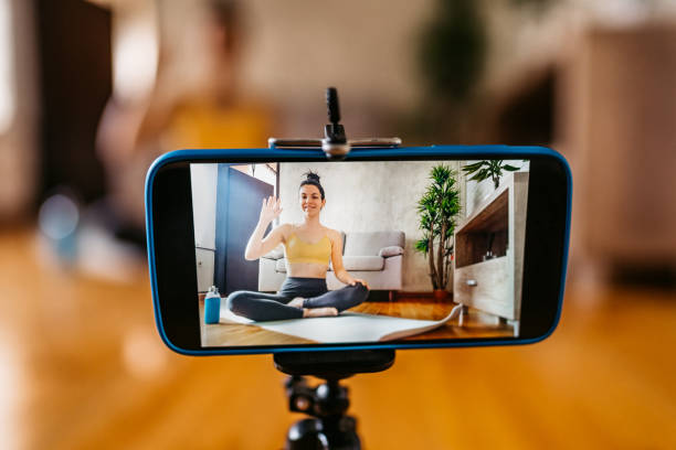 istock Woman Vlogger Practicing Yoga From Home 1370685230