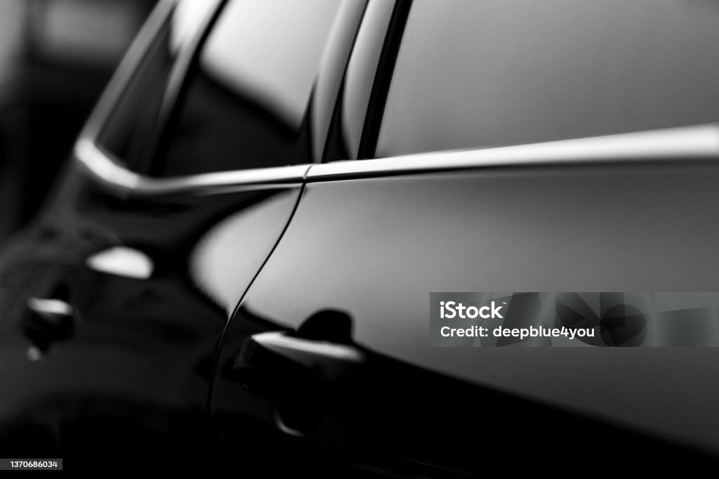 Blurred abstract black car door Blurred abstract view of the car door, with focus on the edge of a black car Car Stock Photo