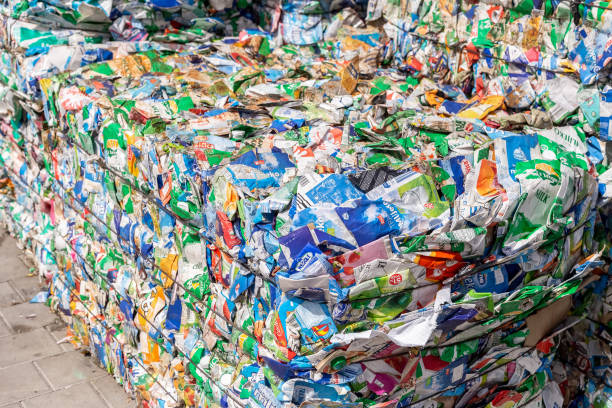 Prelog, Croatia - 27 August, 2021: Large pile of Tetra pack waste collected, pressed and packed into stacks. Waste sorting and recycling
