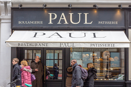 People walking past PAUL Bakery, Patisserie, Café and Restaurant in Covent Garden, London