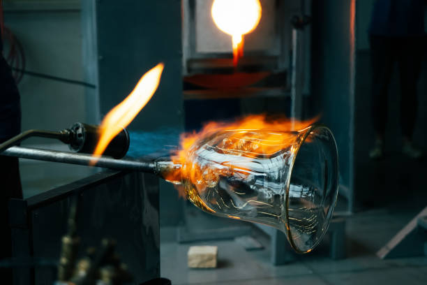 istock Manual glass processing by the craftsmen inside a glass factory 1370690149