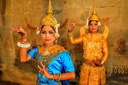 A women shows Apsara dance in old ruins near Siem Reap, Cambodia.