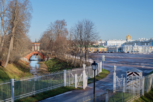 Tsarskoye Selo, Saint-Petersburg, Russia – November 10, 2020: View of The Triangle Square, The Krestovy Bridge with Chinese summer-house and The Catherine Palace in The State Museum Tsarskoye Selo