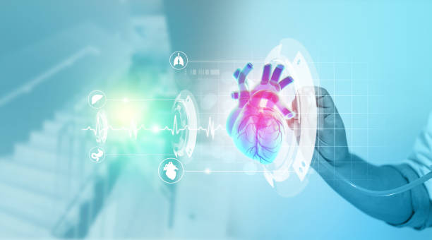 istock Cardiologist listens to the heart on digital technology background 1370691591