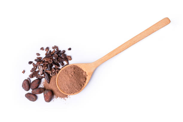 Cocoa powder with cacao beans Cocoa powder in wooden spoon with cacao beans and cocoa nibs isolated on white background. Top view. Flat lay. nib stock pictures, royalty-free photos & images