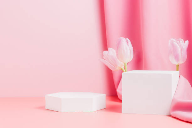 istock Geometric podiums with tulips and pink textile 1370693604
