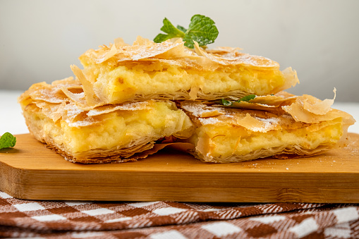 Appetizing pastry made from thin filo dough with custard filling. Bougatsa