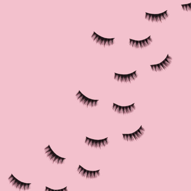 istock Creative pattern made with false eyelashes on pastel pink background. Retro style aesthetic. Trendy and fashion beauty makeup idea. 1370694775