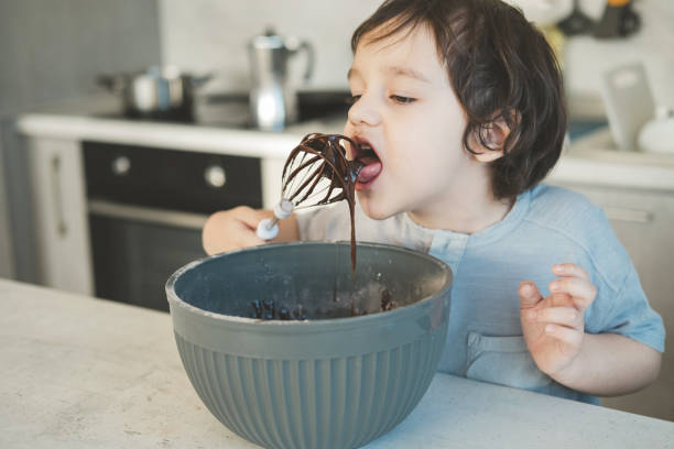 istock A little boy is cooking in the kitchen. 1370694839