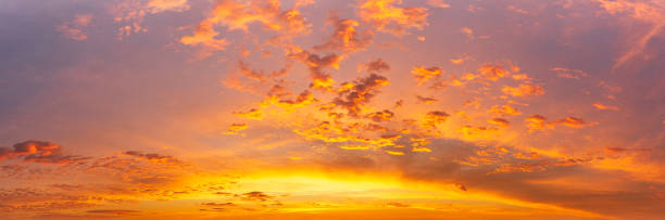 Colorful sky at golden hour morning and fluffy clouds with sunlight, panoramic nature phenomenon background
