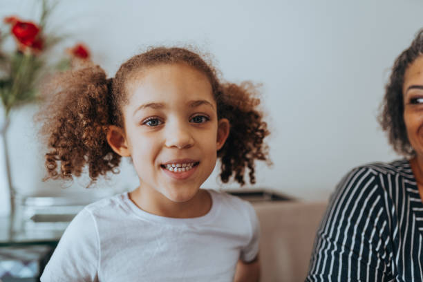 istock Smiling girl at home 1370695087