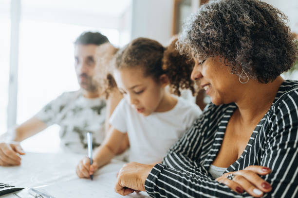 istock Little girl doing homework 1370695116