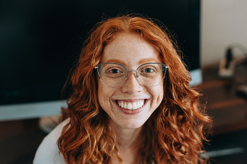 Portrait of a red-haired woman with sardines