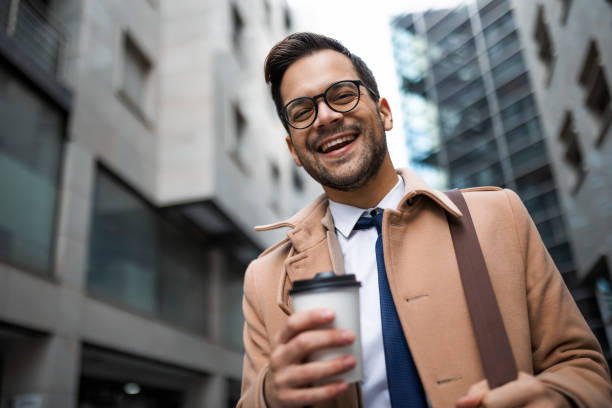 istock Businessman on a way to work looking at camera 1370695609