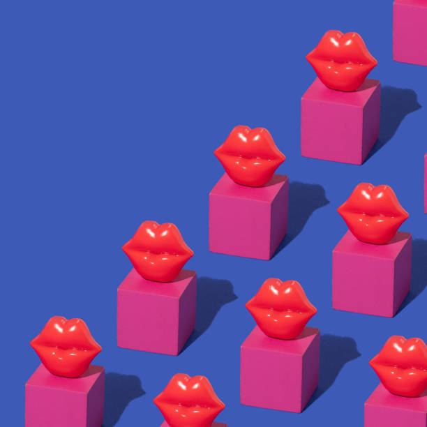 Valentines day creative pattern with red lips figurines and bright cubes on bold blue background. 80s, 90s retro romantic aesthetic kiss concept. Minimal surreal fashion idea.