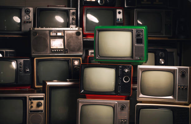 istock Pile old retro television (TV) vintage filter effect style in the room. 1370696628