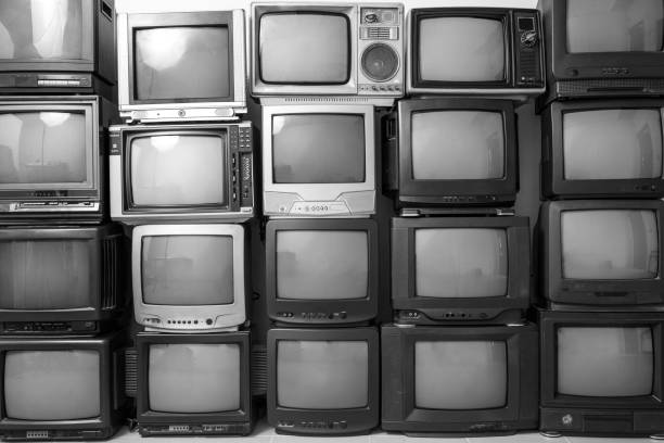 istock Black and white stack of old tv. Retro old television pile background. 1370696658