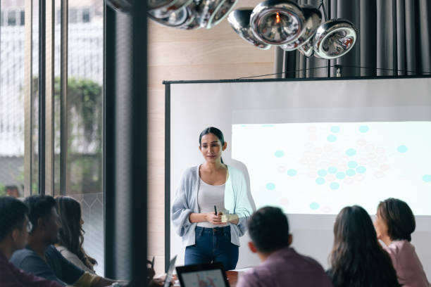 istock Mature woman leads meeting 1370696847