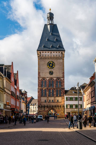 Speyer, Germany - February 05, 2022: The Old Gate Altpoertel in Speyer is the medieval city gate. It  is 55 m high. In front is the pedestrian zone of Speyer.