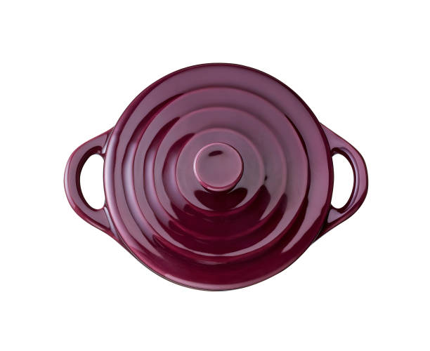 purple cast iron enamel frying pan. Dutch oven, isolated on white stock photo