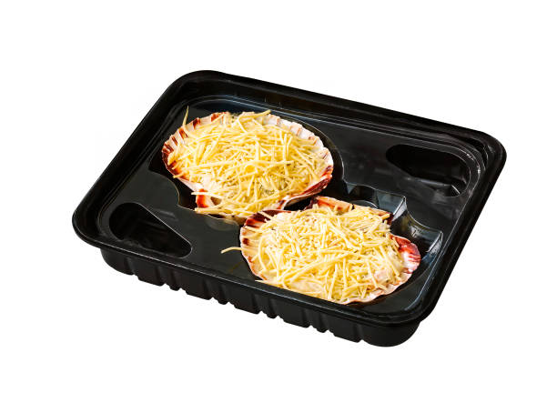 istock scallop in black plastic tray isolated on white with clipping path 1370697253