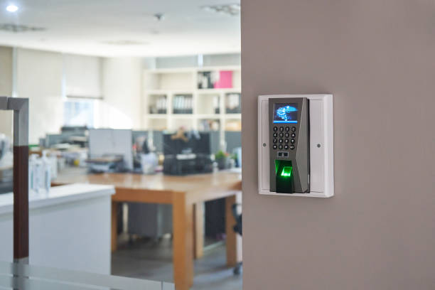 istock Fingers scanner device on Wall in front of blur lobby interior. 1370699130